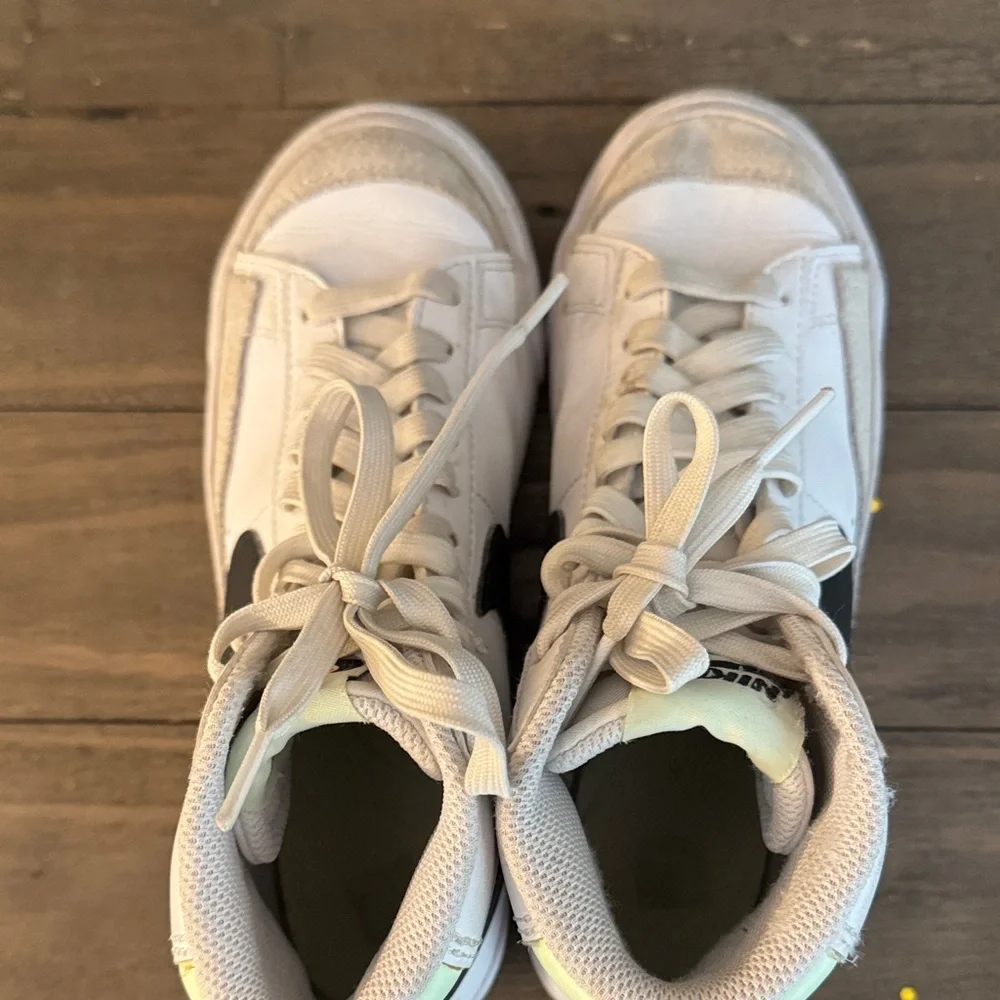 Nike White High-Top Sneakers with Black Swoosh